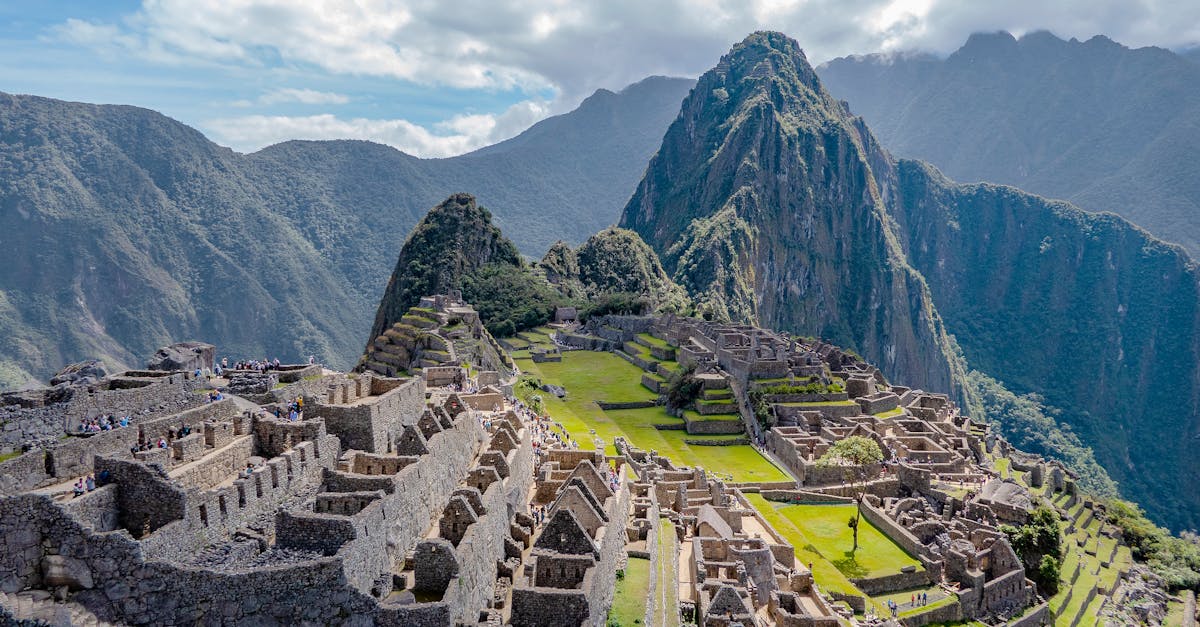 discover the ancient incan city of machu picchu, nestled high in the andes mountains, with its breathtaking panoramic views and mysterious ruins.